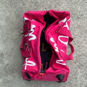 Victoria’s Secret pink luggage bag